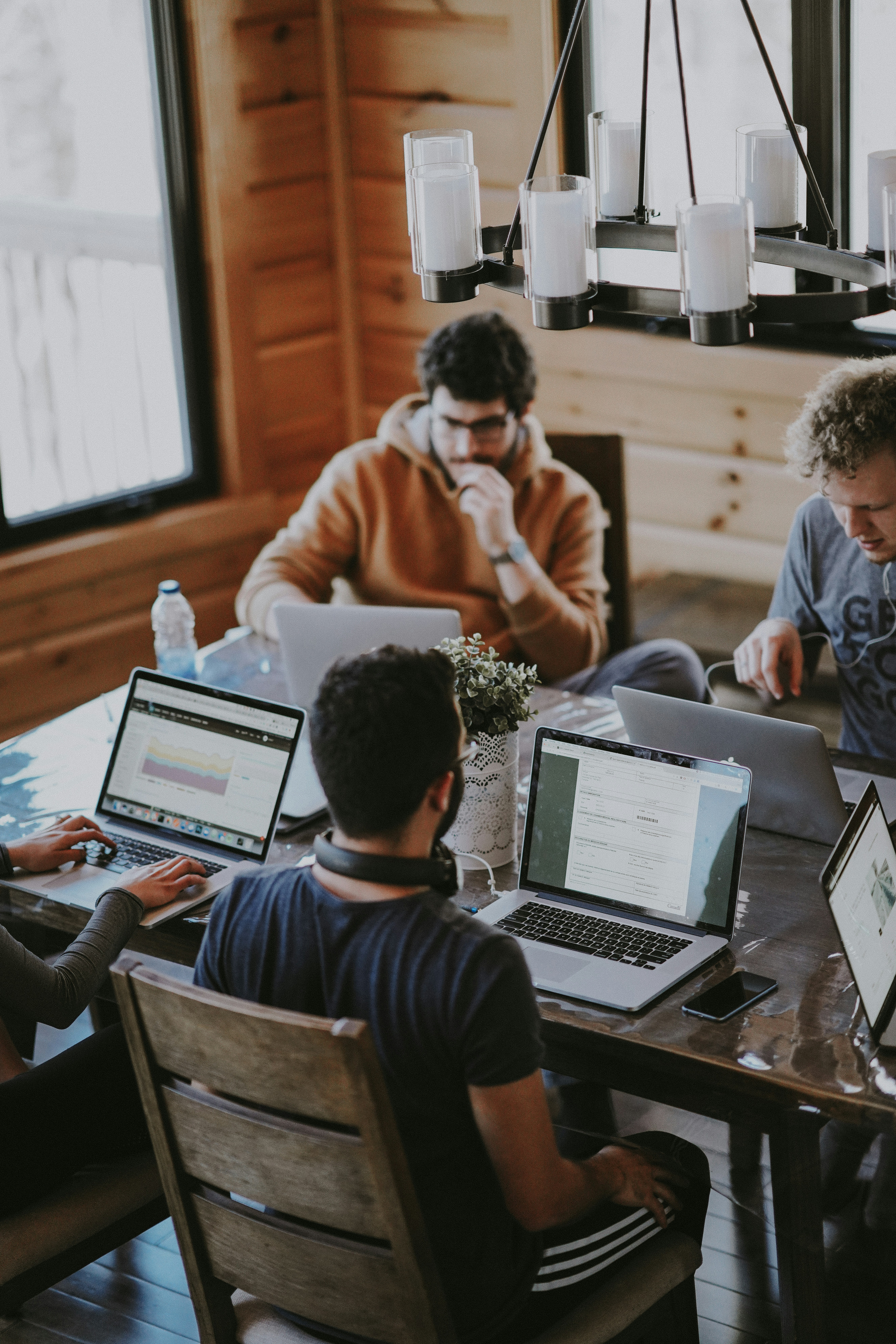 Business team collaborating around a laptop